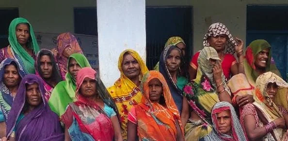 A group of women gathered in the community